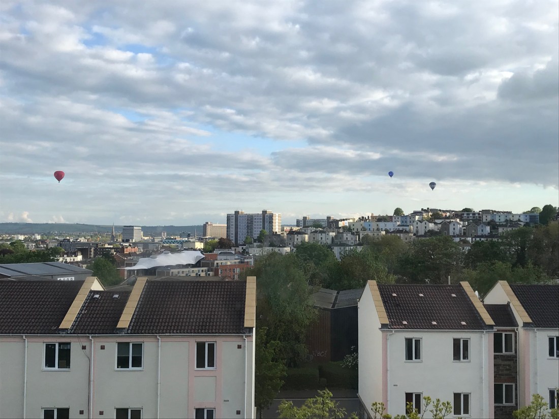 Skyline view over the city of Bristol, featuring hot air balloons